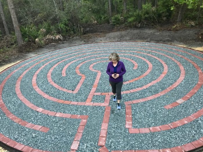 woman walks a labyrinth on a yoga retreat in jacksonville florida